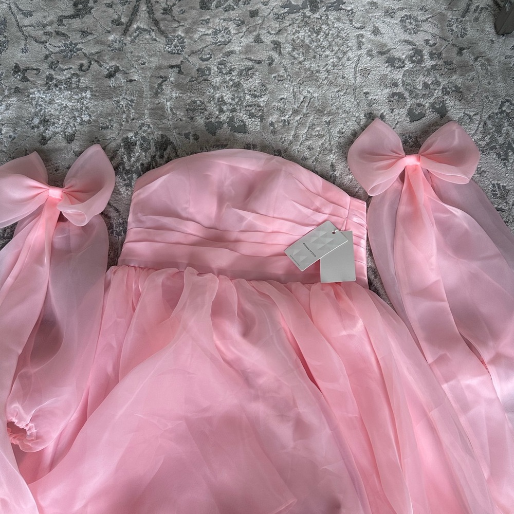 Elegant Pink dress with pink bows as sleeves
